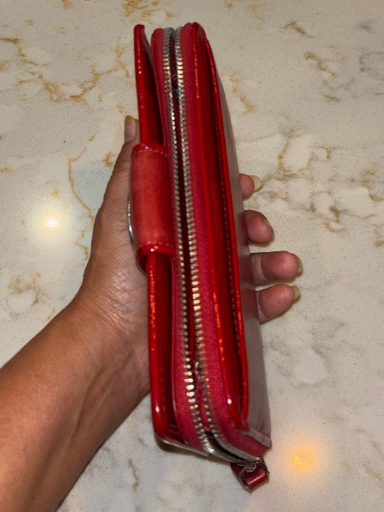 Brighton Red leather wallet featuring a decorative silver-toned snap closure. - Picture 3 of 16